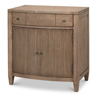 Low traditional door chest in brown pine with reeded vertical door panels and iron ring pulls