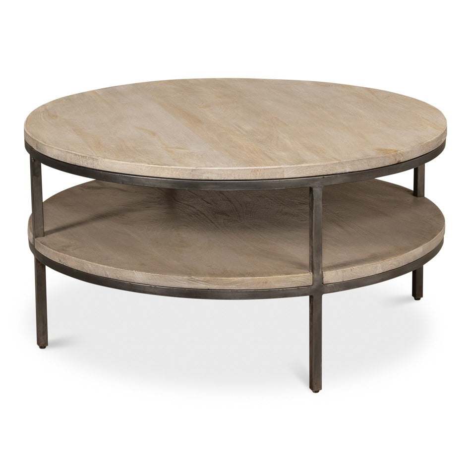 round two-tier mango wood coffee table in a vintage gray wash finish with lower display shelf