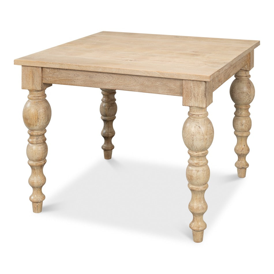 square mango wood dining table with bobbin-turned legs in a natural Sienna finish