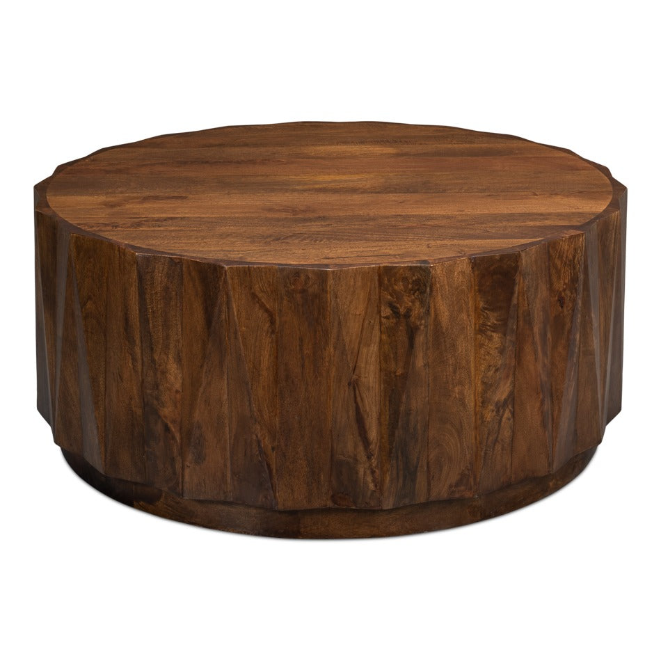 Round organic modern cocktail table in warm brown mango wood with solid drum pedestal base