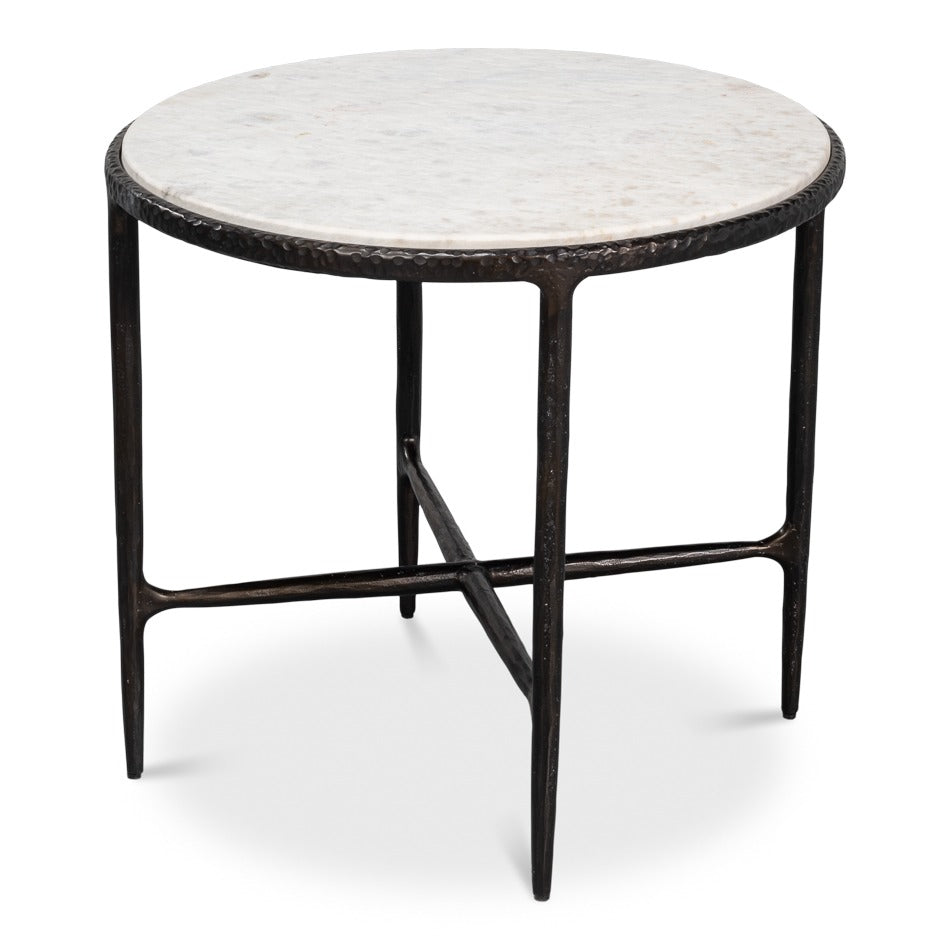 round distressed white marble side table on a rustic black forged iron base
