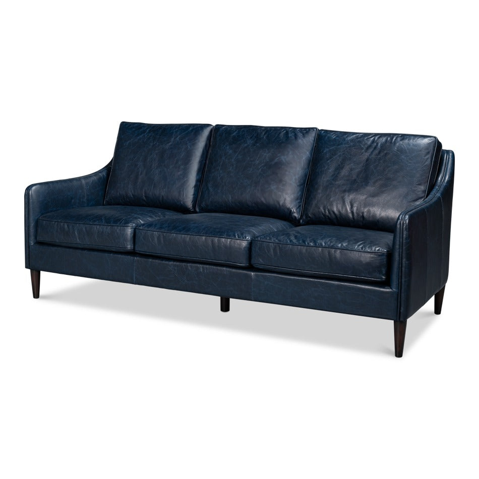 Contemporary three-cushion sofa in deep chateau blue leather with slim track arms and tapered dark wood legs