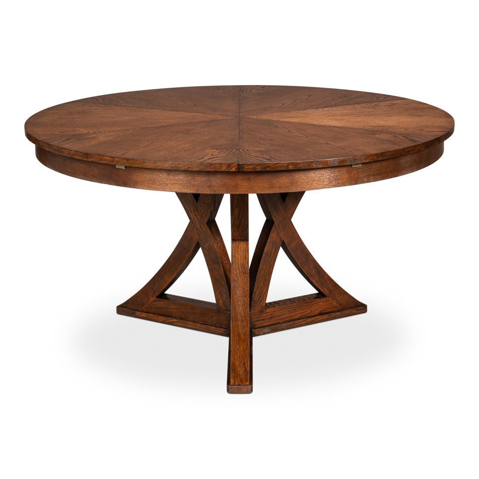 Transitional Round Jupe Dining Table, Large – Warm Brown Oak with Sculptural X-Form Pedestal – styled view