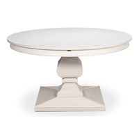 Round white reeded pedestal Jupe dining table with sculptural carved base and expanding top in a working white finish
