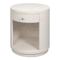 contemporary round side table in soft white ashwood with a single drawer and an open ring-form niche below the top