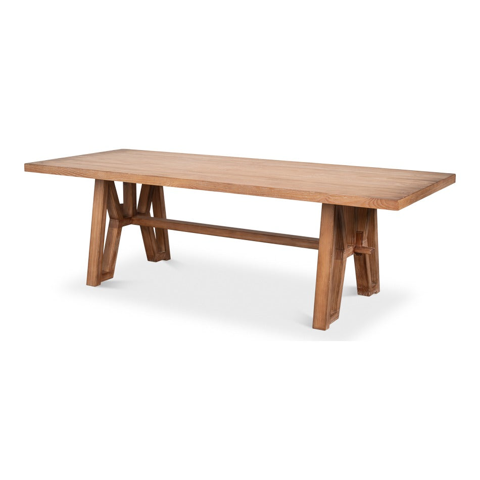 Rustic 98-inch trestle dining table in natural aged pine with plank top, geometric cutout trestle ends, and a horizontal stretcher