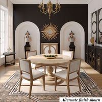 Dining room with round table, alternate finish shown.