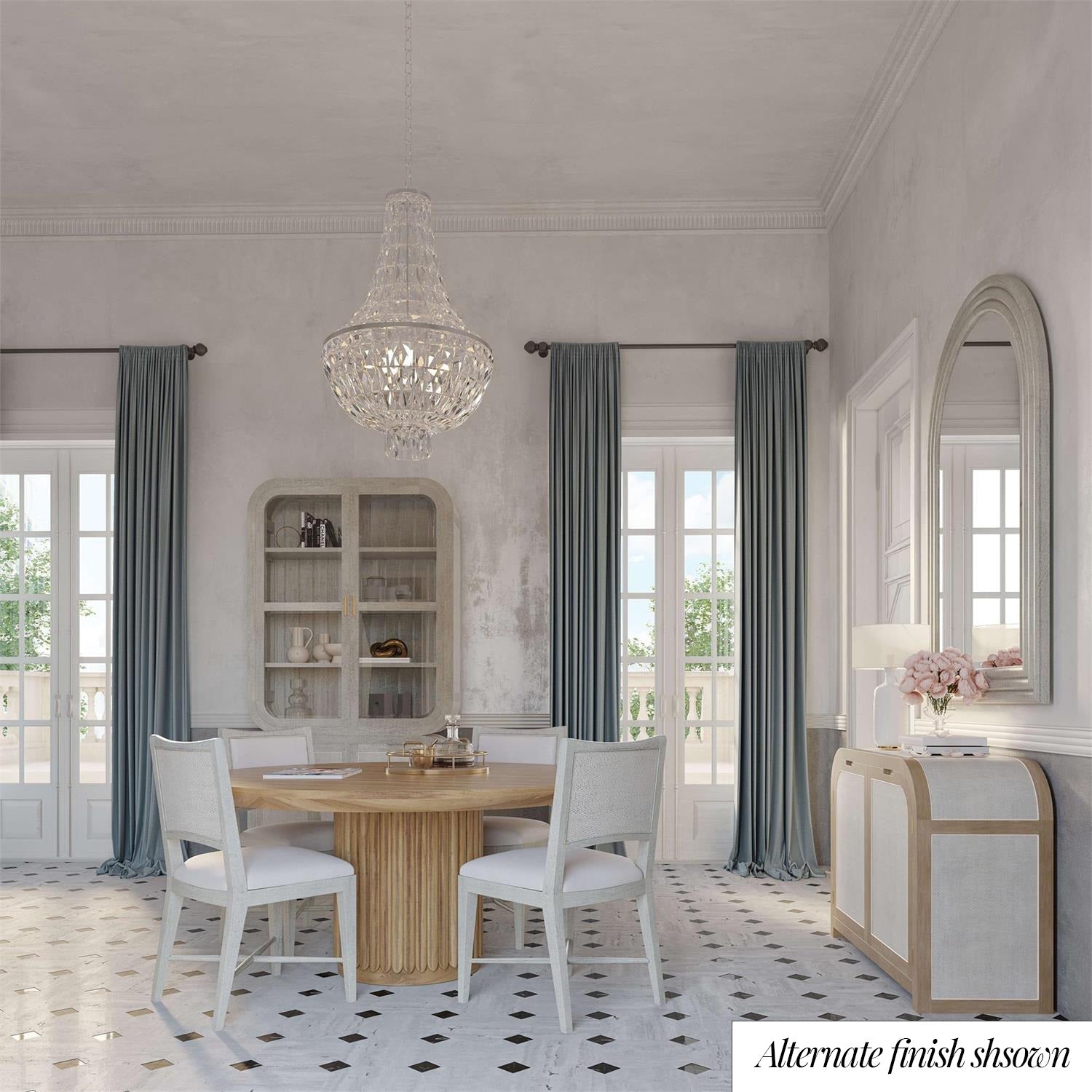 Elegant dining room featuring table, chandelier, and curtains.