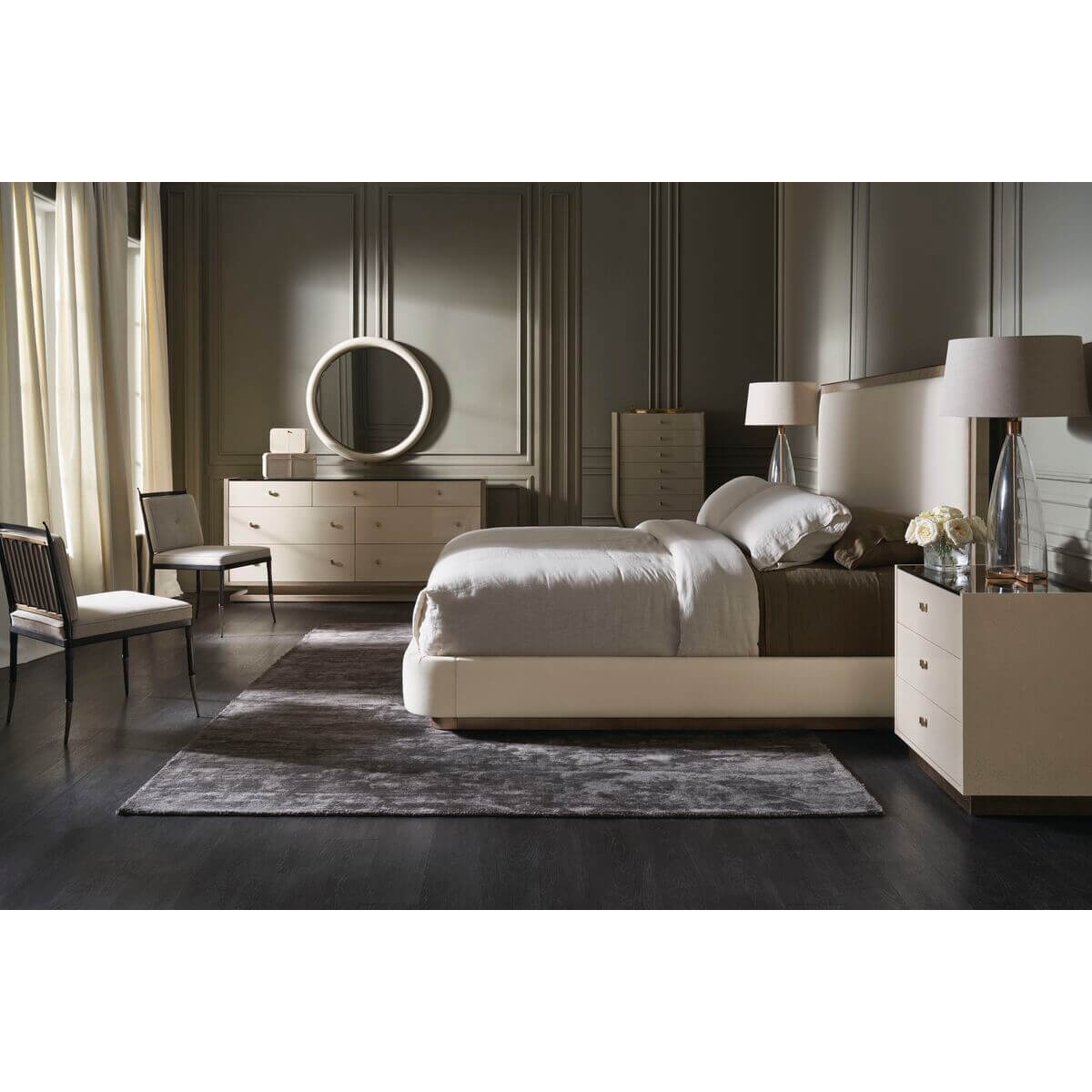 Bedroom setup featuring classic modern upholstered queen bed.