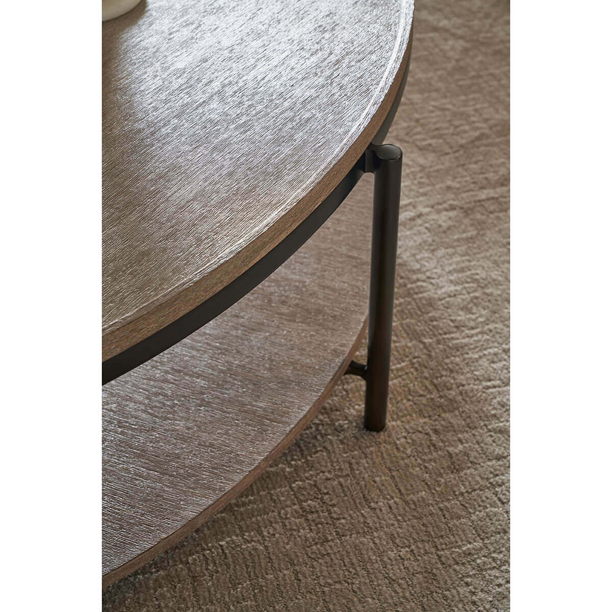 Coffee table detail on textured surface.
