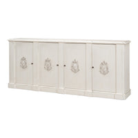 Long four-door white wall cabinet with carved crest appliqués and lightly distressed finish