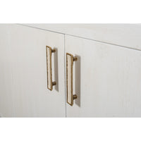 Close-up of brass-toned vertical door handles on white doors