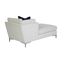 Rear angle of white chaise with minimal design.