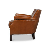 Leather armchair side profile showing armrest detail.