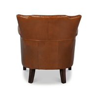 Leather armchair rear view showcasing elegant curves.