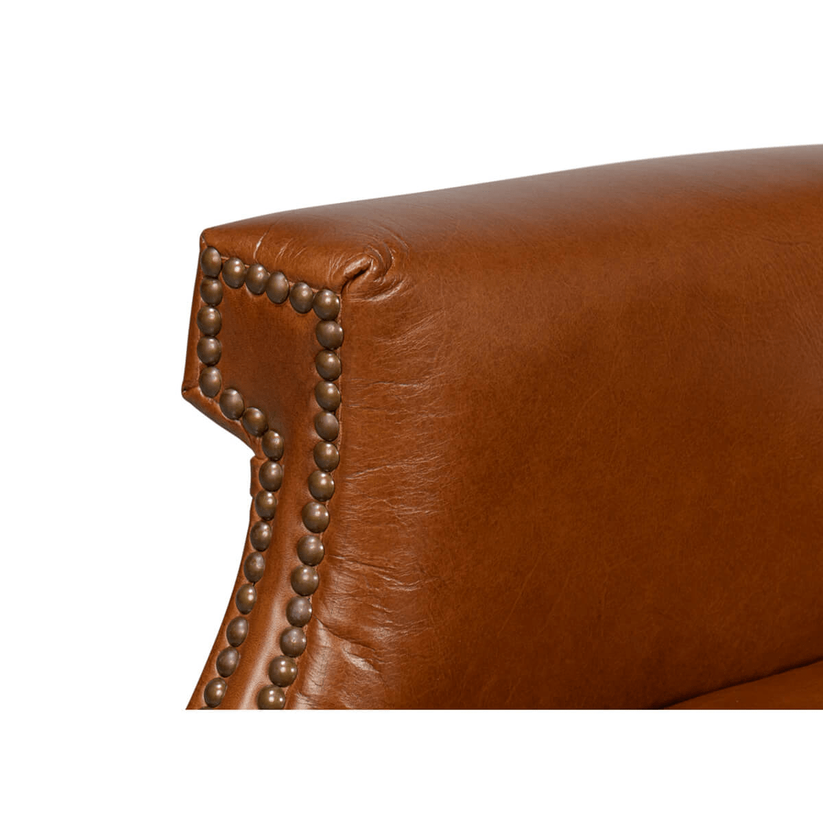Close-up of armrest detail with nailhead accents.