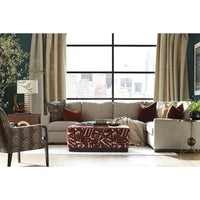Neutral sectional sofa in styled living room.