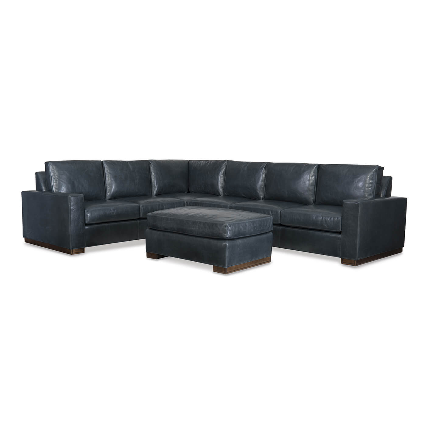 Dark blue leather sectional sofa with ottoman.