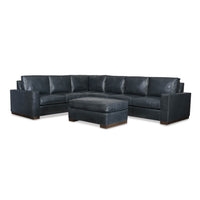 Dark blue leather sectional sofa with ottoman.