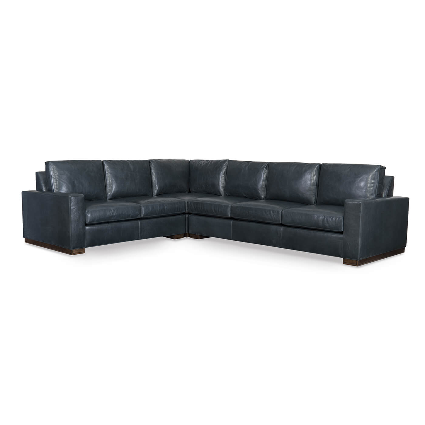 Blue sectional sofa without ottoman in studio setting.