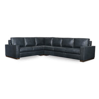 Blue sectional sofa without ottoman in studio setting.