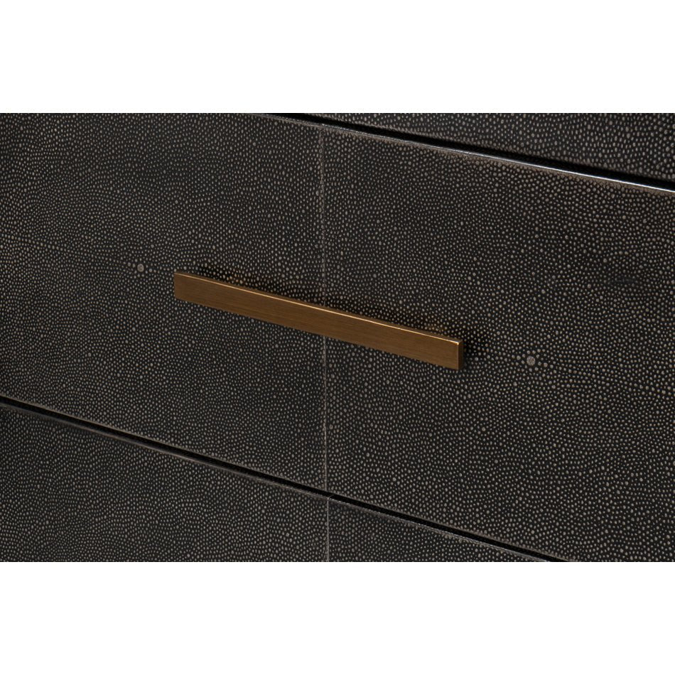 Close-up of sideboard drawer with gold handle.