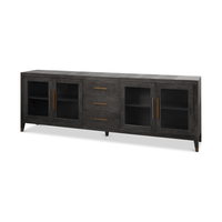Angled view of leather sideboard with glass doors.