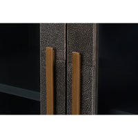 Detail of sideboard cabinet doors with gold handles.