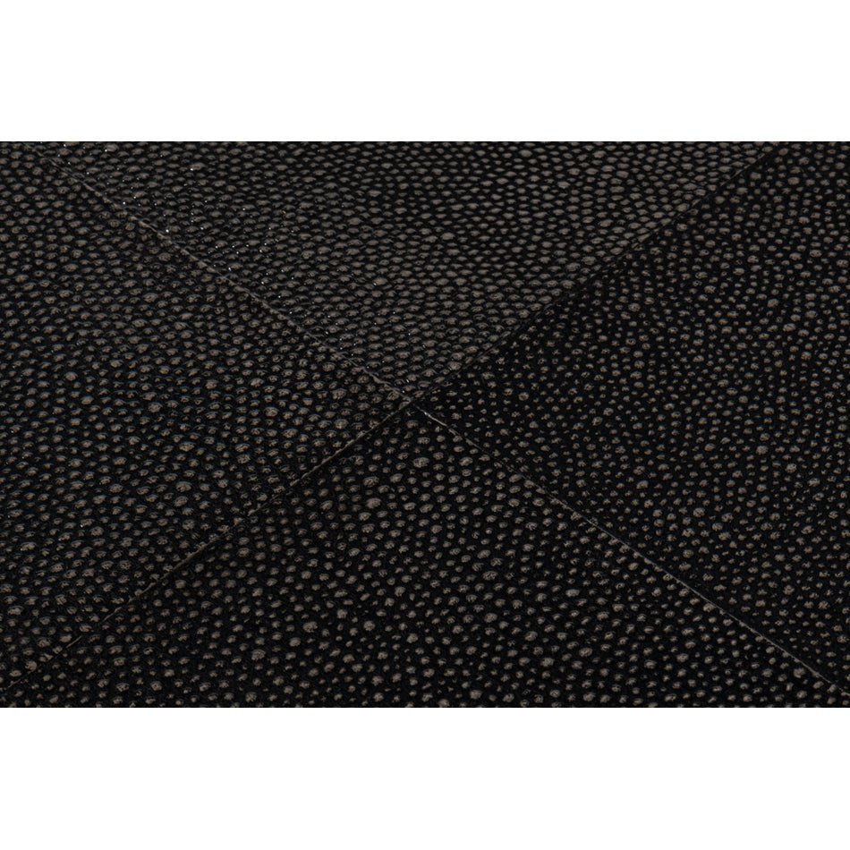 Close-up of textured black leather surface detail.