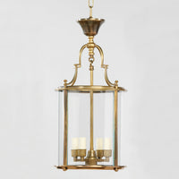 Antique round lantern, brass, glass panels, front angle.