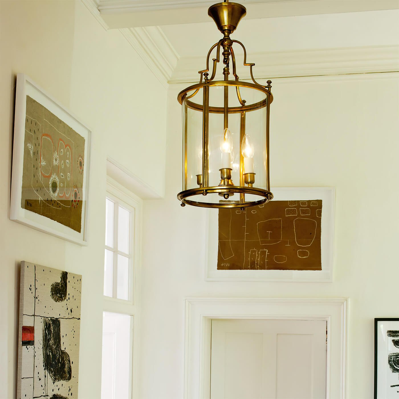 Antique lantern hanging in hallway, ambient lighting.
