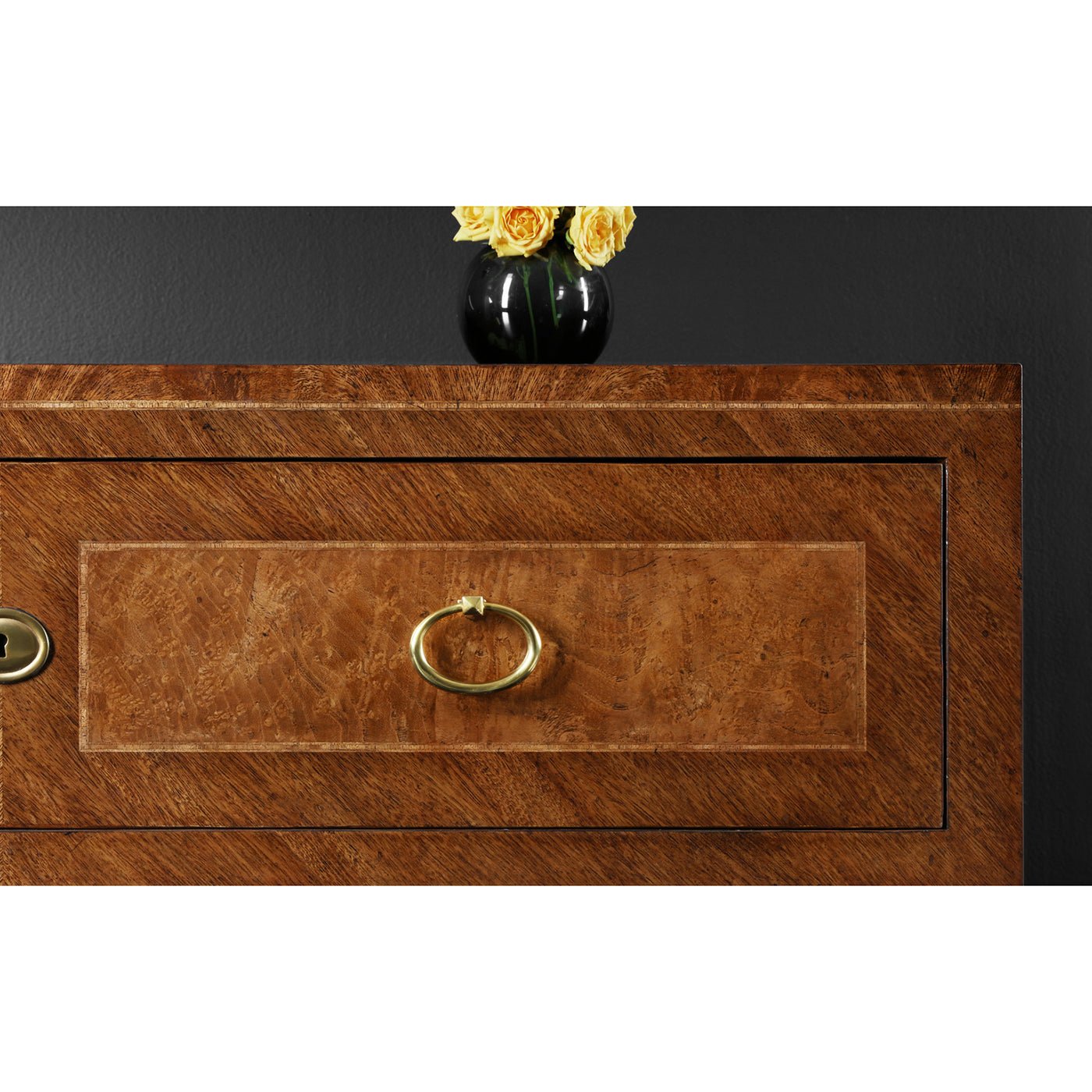 Drawer handle detail on antique style chest of drawers.