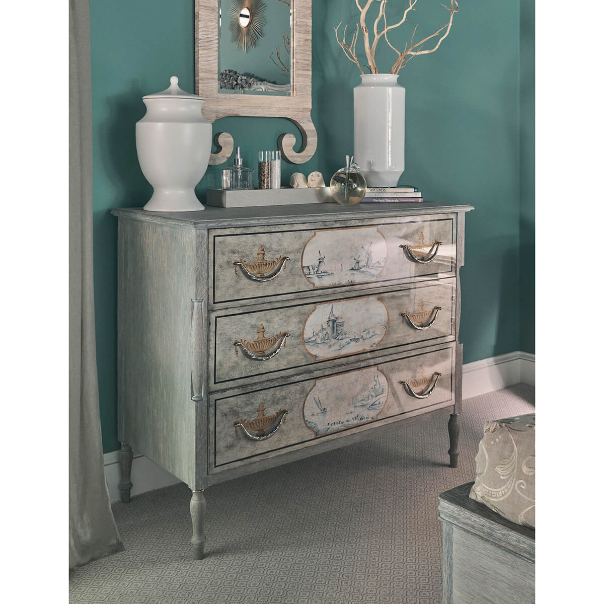 Antique-style commode in room setting, decorative items on top.