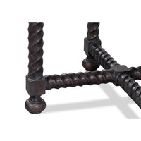 Close-up of twisted legs and connector detail, table.