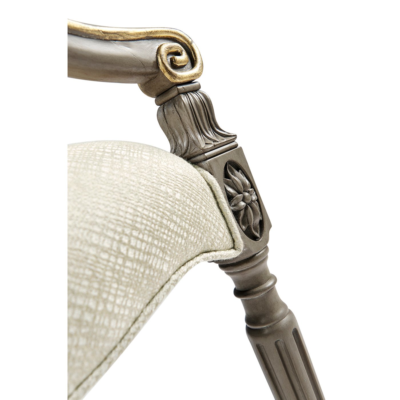 Close-up of dining chair armrest and leg detail.