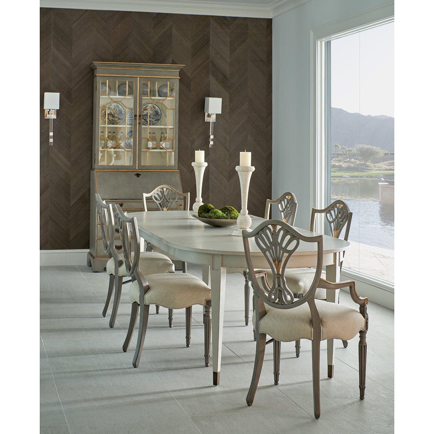 Dining chairs around table with large window view.