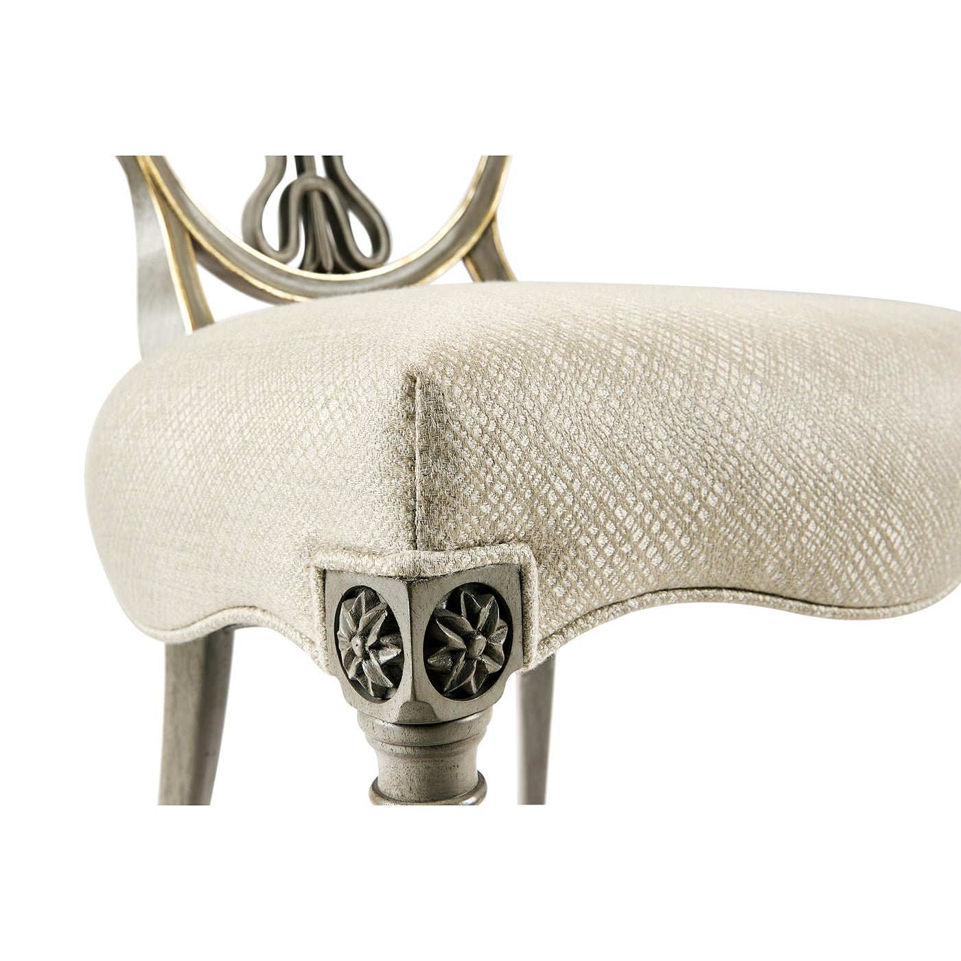 Close-up of chair seat cushion and leg design.