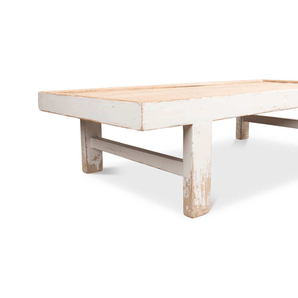 Detailed angled leg view of farmhouse coffee table.