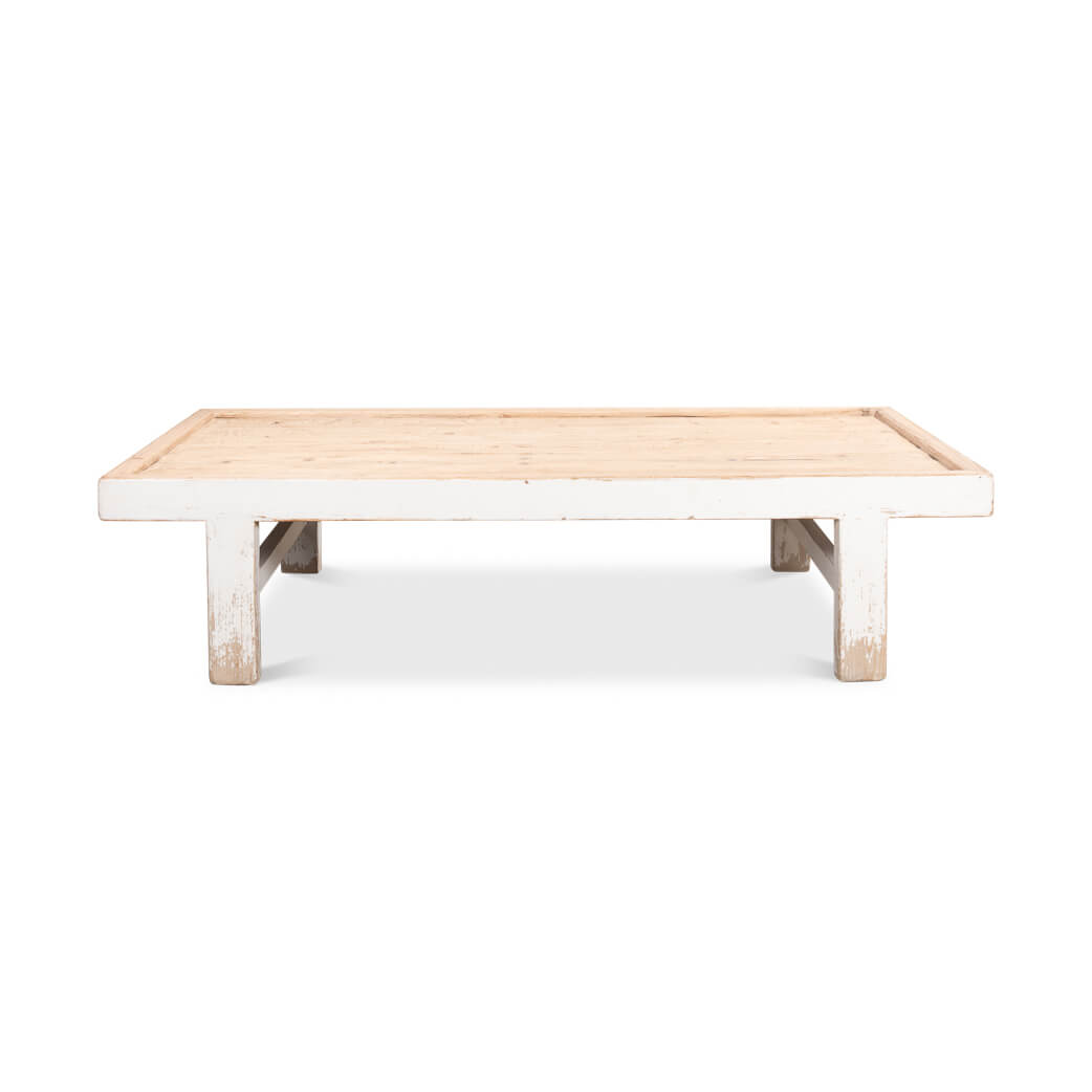 Front view of antique white farmhouse coffee table.