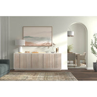Antique white sideboard in modern living room setting.