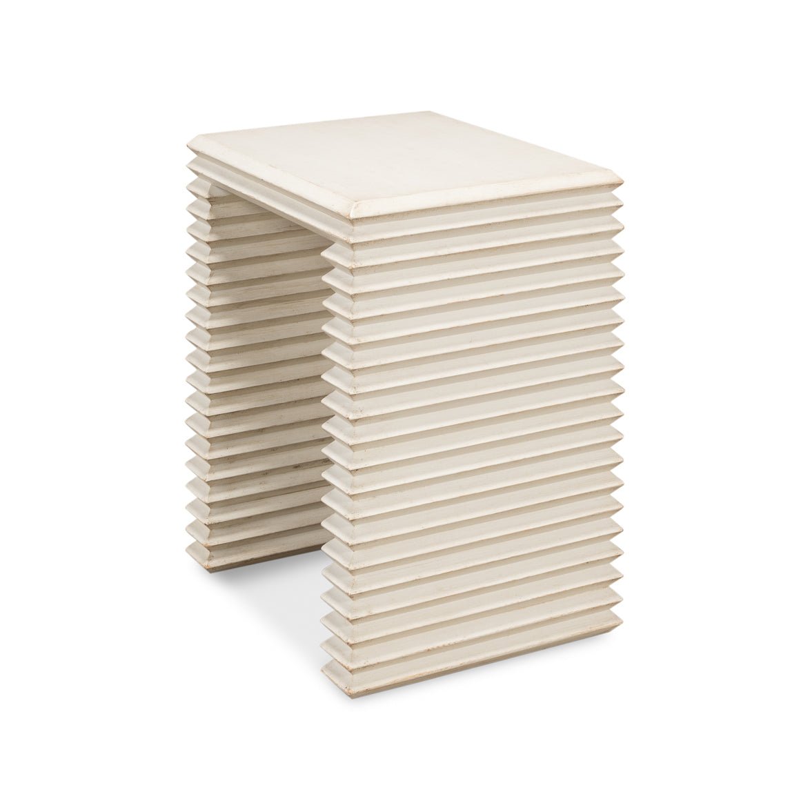 Angled view of antique white stacked side table.