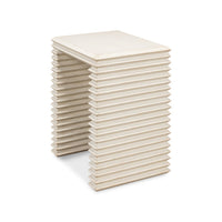 Angled view of antique white stacked side table.