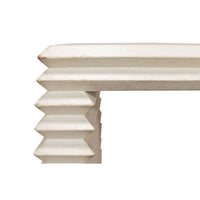 Corner detail of antique white stacked side table.