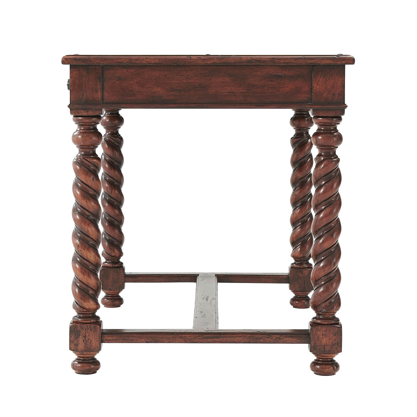 Side view of antique writing desk with ornate legs.
