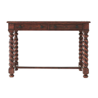 Facade of 17th-century writing table with twisted legs.