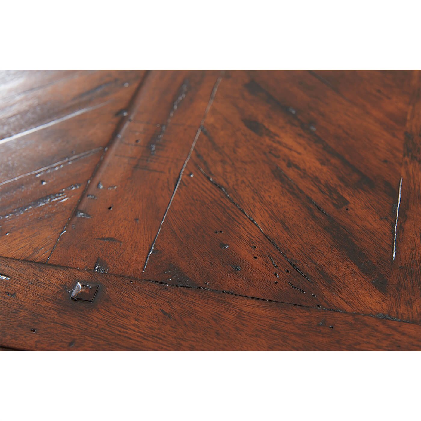 Close-up of distressed wooden texture on writing table surface.
