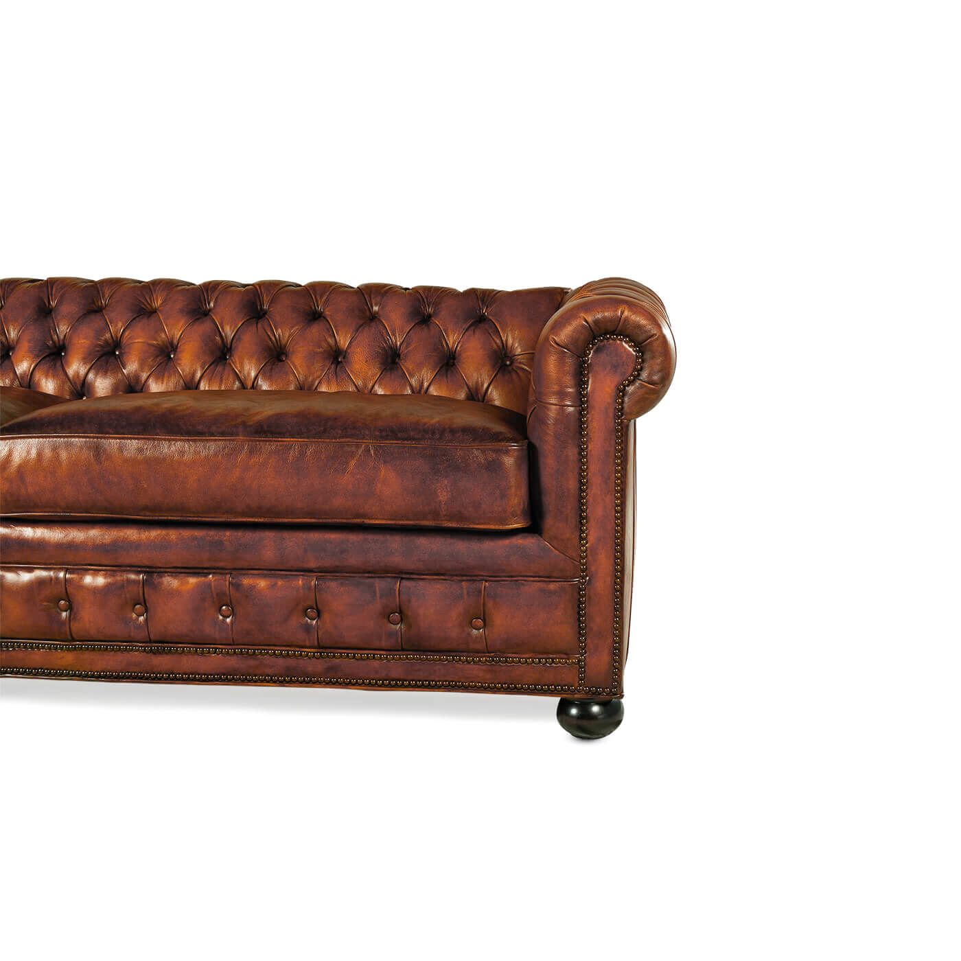 Right side close-up of Chesterfield leather sofa arm.