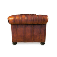 Side view of Chesterfield leather sofa arm.