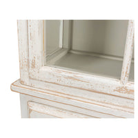 Close-up of rustic bookcase corner, distressed details.