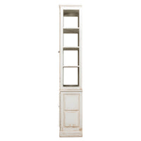 Side view of white rustic bookcase, top and bottom doors.